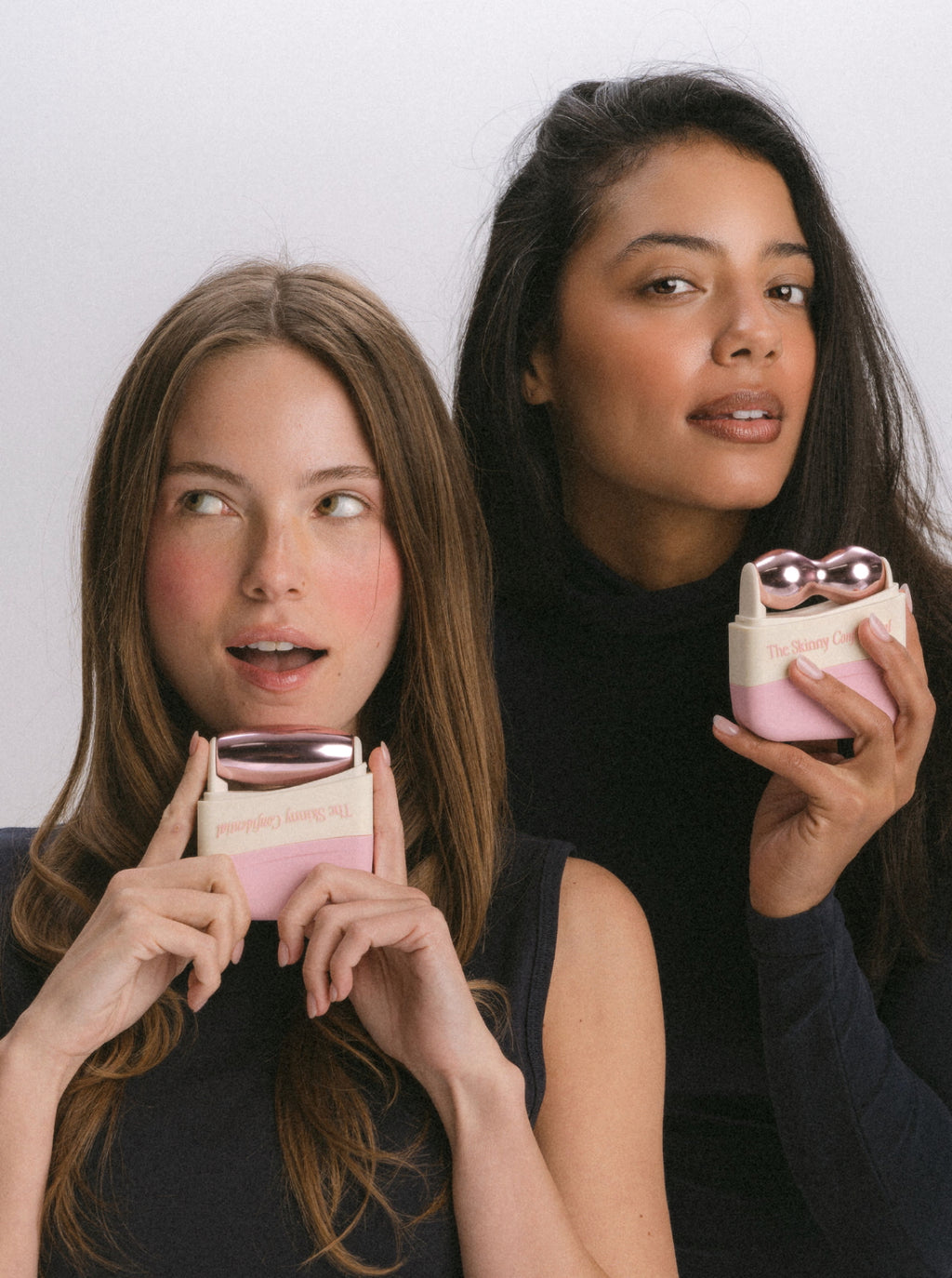 Two women holding beauty face massager skincare products Two women holding beauty face massager skincare products