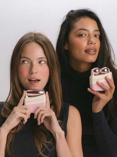 Two women holding beauty face massager skincare products Two women holding beauty face massager skincare products