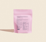 pink supplement powder bag with text and supplement facts