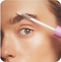 Eyebrow grooming with brush close-up Eyebrow grooming with brush close-up