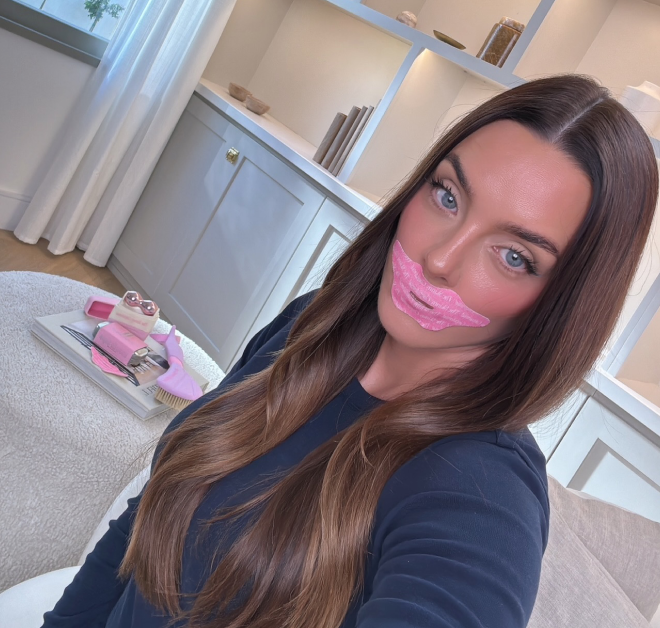 Woman with pink lip mask at home. Woman with pink lip mask at home.
