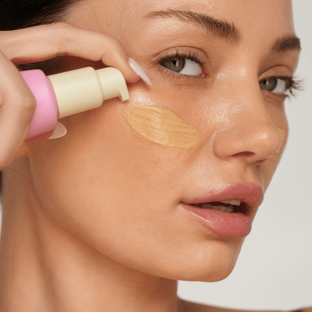 woman applying foundation makeup face beauty routine woman applying foundation makeup face beauty routine