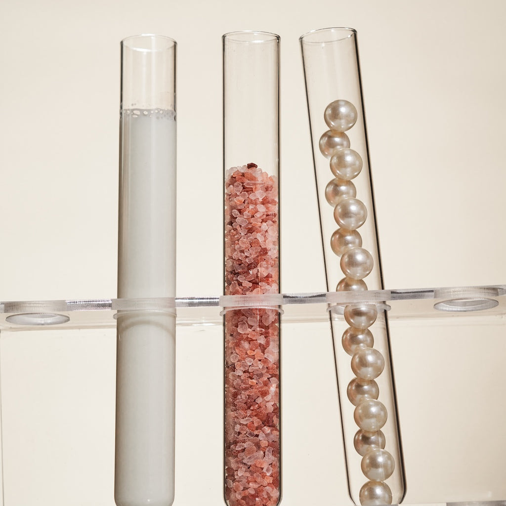 test tubes with liquid salt and pearls test tubes with liquid salt and pearls