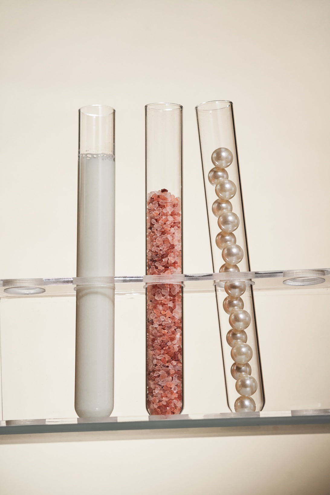 test tubes with liquid salt and pearls